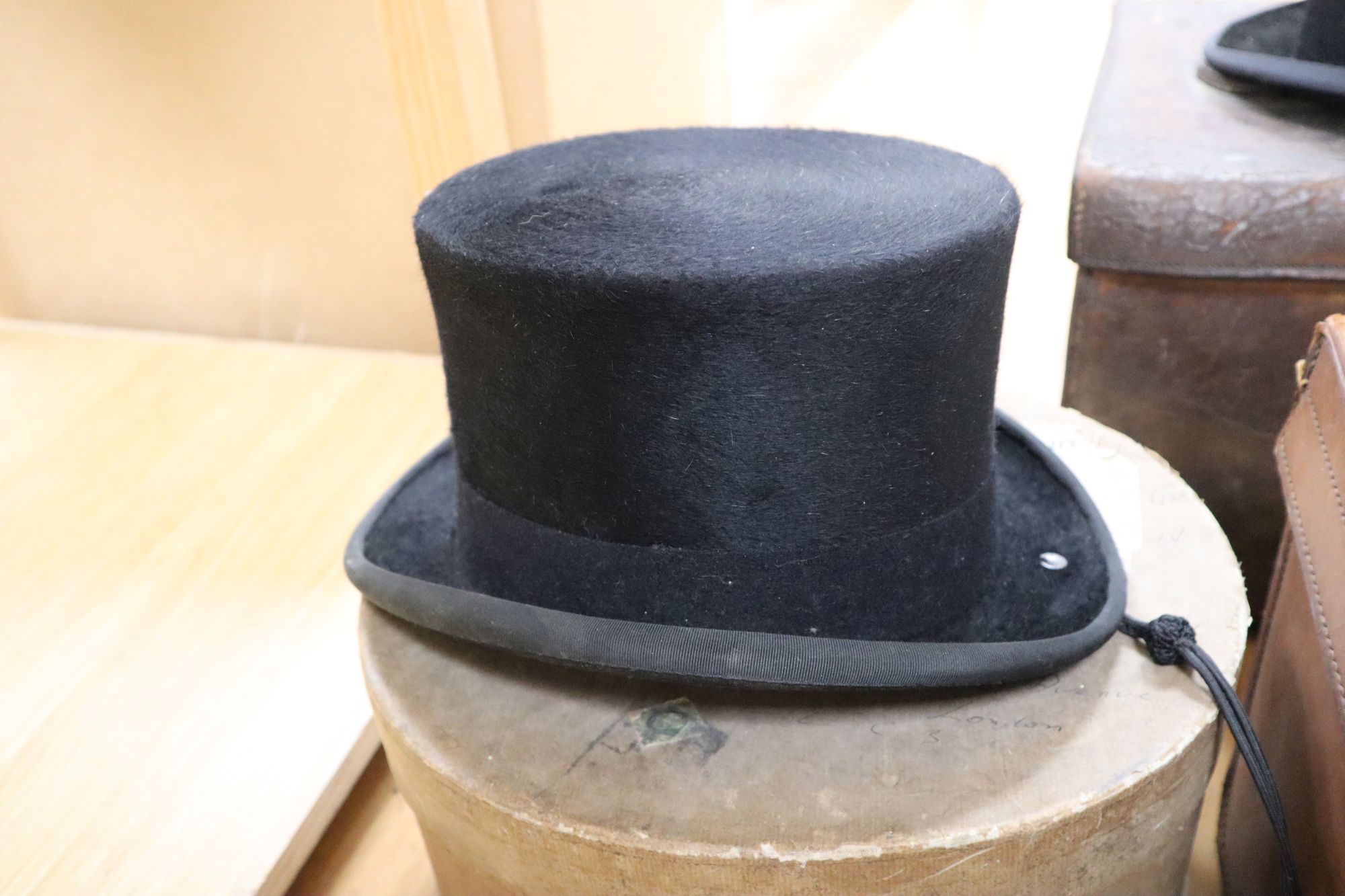 Two Victorian Locke & Co silk top hats and two felt top hats